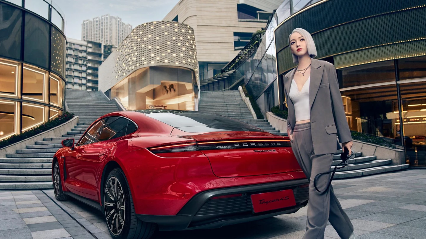 Ayayi beside a Porsche Taycan in official 2022 campaign artwork.