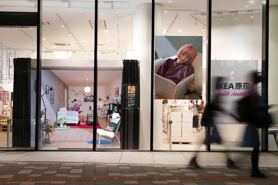 The IKEA Harajuku storefront installation combining imma on a screen with a furnished physical room.